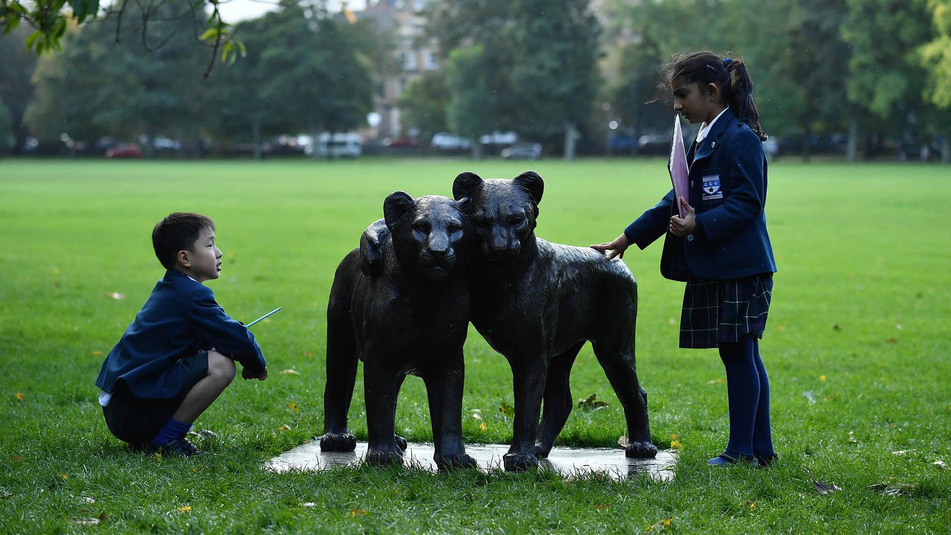 Students from George Heriot’s School at ‘Born Free Forever’, an exhibition opening today at The Meadows in Edinburgh by international wildlife charity, Born Free, aiming to raise awareness of threats facing the lion population. Mark Runnacles/PA Wire.